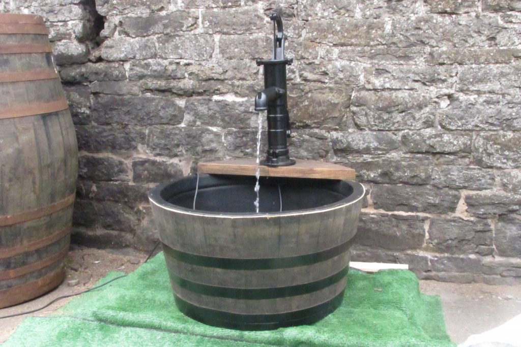 garden in winter | heating fish pond in winter | oak barrel